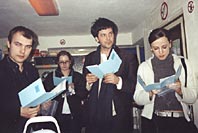 Visitors (confused?) checking the blue folders of David Goldenberg